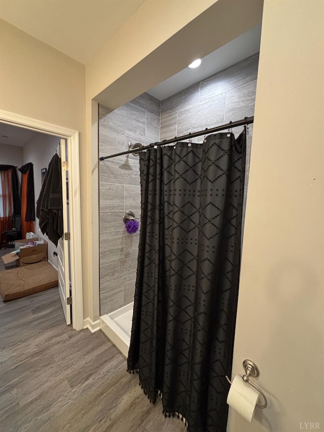 316 E Franklin St, Bedford, VA 24523 - full bathroom with a shower stall, wood finished floors, and baseboards