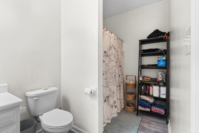 278 Tallyho, Concord, VA 24538 - full bathroom featuring wood finished floors, toilet, vanity, baseboards, and curtained shower