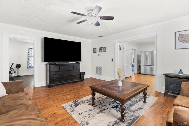 278 Tallyho, Concord, VA 24538 - living room with crown molding, a ceiling fan, light wood-style flooring, and baseboards