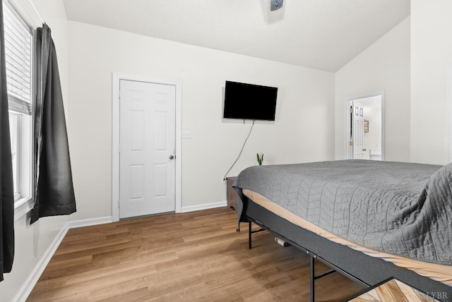278 Tallyho, Concord, VA 24538 - bedroom featuring wood finished floors, lofted ceiling, and baseboards