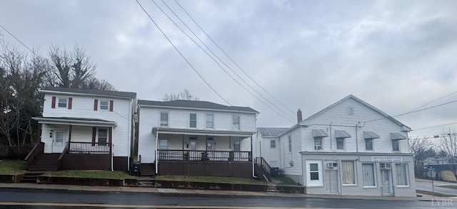 view of front of house featuring a porch and stairs