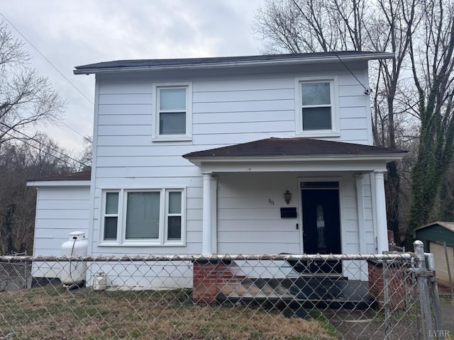 view of front facade with roof with shingles and a porch