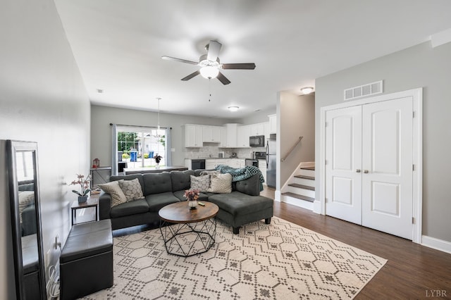 321 Meridian St, Lynchburg, VA 24502 - living area with a ceiling fan, wood finished floors, stairs, and baseboards