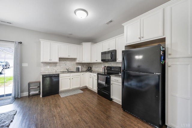 321 Meridian St, Lynchburg, VA 24502 - kitchen featuring black appliances, a sink, tasteful backsplash, dark wood finished floors, and white cabinetry