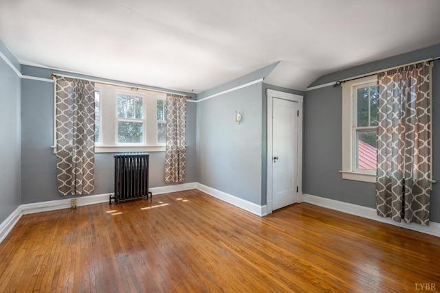 264 N Five Forks Rd, Amherst, VA 24521 - spare room with radiator heating unit, hardwood / wood-style floors, baseboards, and lofted ceiling