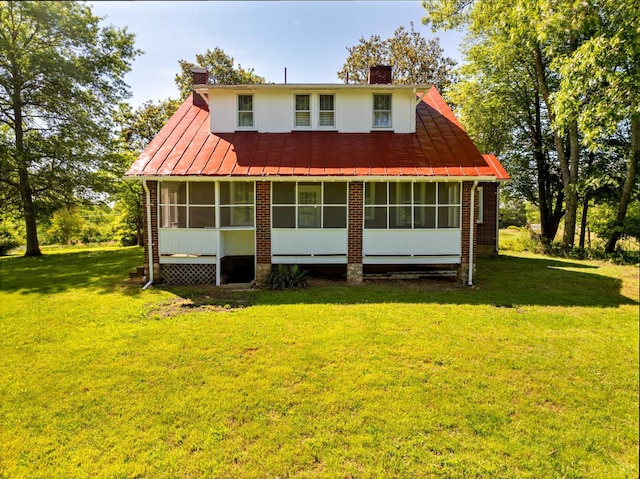 264 N Five Forks Rd, Amherst, VA 24521 - rear view of house with a sunroom, a standing seam roof, brick siding, a chimney, and a yard