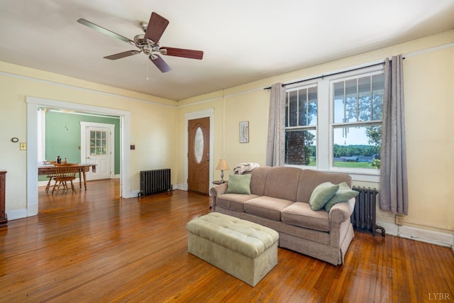 264 N Five Forks Rd, Amherst, VA 24521 - living area featuring radiator heating unit, hardwood / wood-style floors, ceiling fan, and healthy amount of natural light