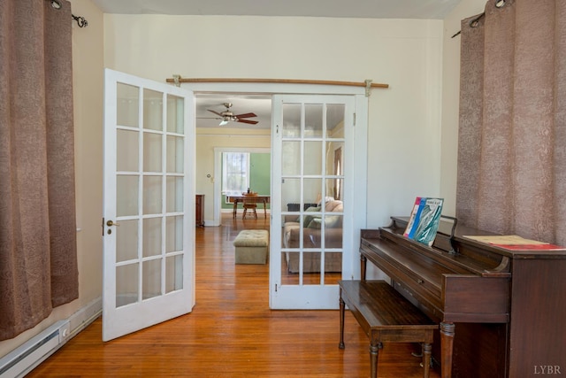 264 N Five Forks Rd, Amherst, VA 24521 - entryway with baseboard heating, wood finished floors, french doors, and ceiling fan