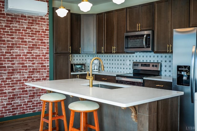 722 Polk St, Lynchburg, VA 24504 - kitchen with appliances with stainless steel finishes, a wall mounted AC, a sink, dark brown cabinetry, and light countertops