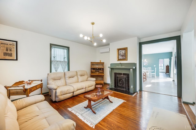 722 Polk St, Lynchburg, VA 24504 - living area featuring a wall mounted AC, healthy amount of natural light, and wood finished floors