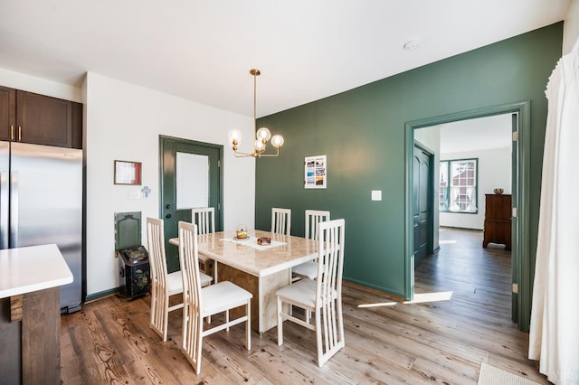 722 Polk St, Lynchburg, VA 24504 - dining room featuring a chandelier and light wood-type flooring