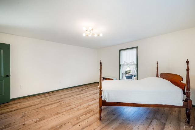 722 Polk St, Lynchburg, VA 24504 - bedroom with a chandelier, wood finished floors, and baseboards