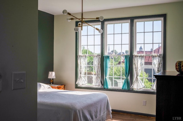 722 Polk St, Lynchburg, VA 24504 - bedroom featuring wood finished floors and a chandelier