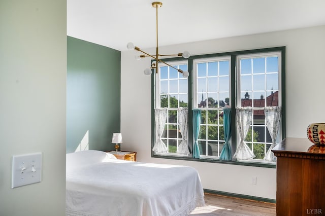 722 Polk St, Lynchburg, VA 24504 - bedroom featuring a chandelier and wood finished floors