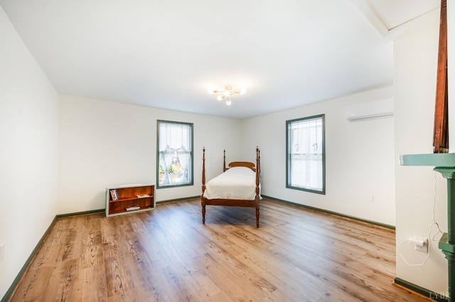 722 Polk St, Lynchburg, VA 24504 - bedroom featuring a wall mounted air conditioner, wood finished floors, and baseboards