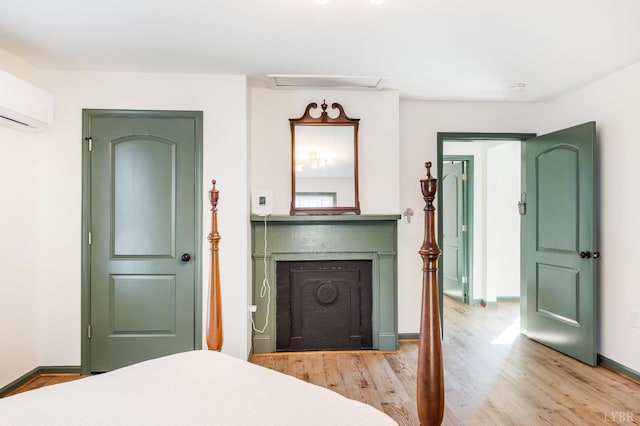 722 Polk St, Lynchburg, VA 24504 - bedroom featuring light wood-style flooring, baseboards, and an AC wall unit