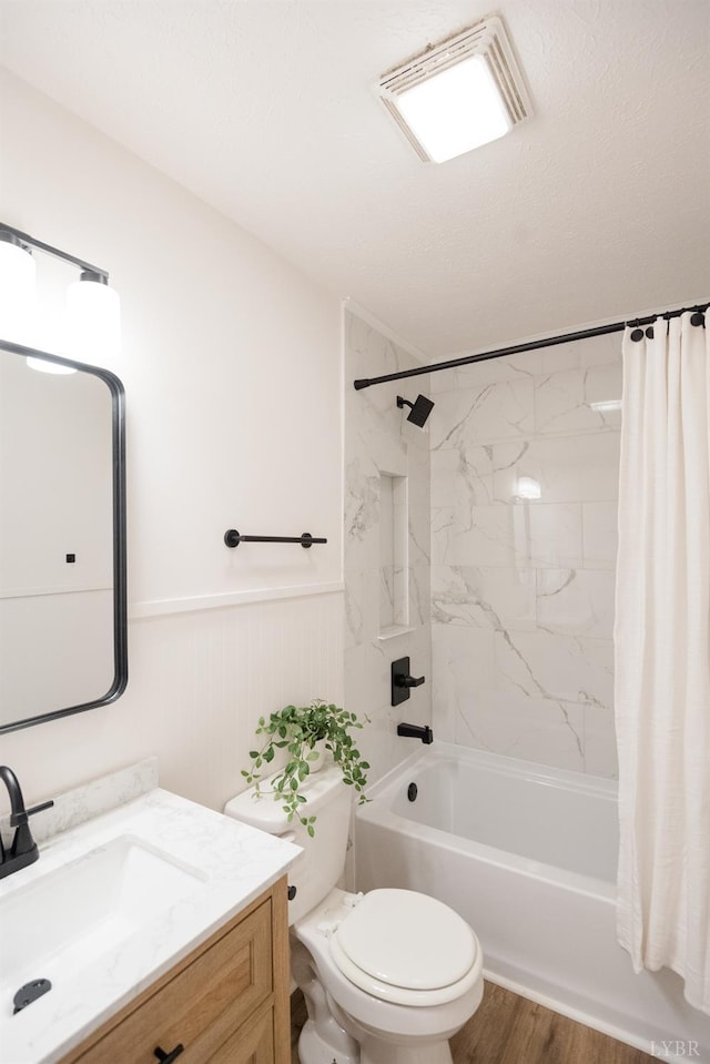 3501 Fort Ave Unit 27, Lynchburg, VA 24501 - bathroom with vanity, a wainscoted wall, shower / tub combo with curtain, toilet, and wood finished floors