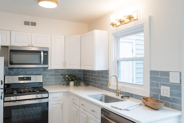 3501 Fort Ave Unit 27, Lynchburg, VA 24501 - kitchen featuring stainless steel appliances, a sink, and white cabinets