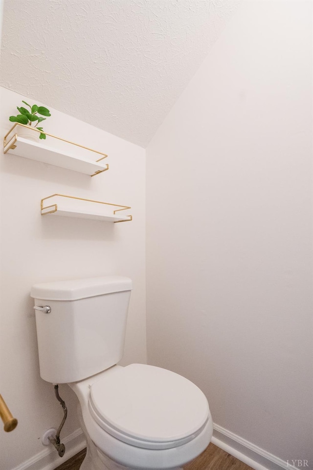 3501 Fort Ave Unit 27, Lynchburg, VA 24501 - bathroom featuring toilet, baseboards, lofted ceiling, a textured ceiling, and wood finished floors