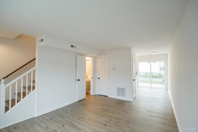 3501 Fort Ave Unit 27, Lynchburg, VA 24501 - spare room with light wood-type flooring, baseboards, and stairway