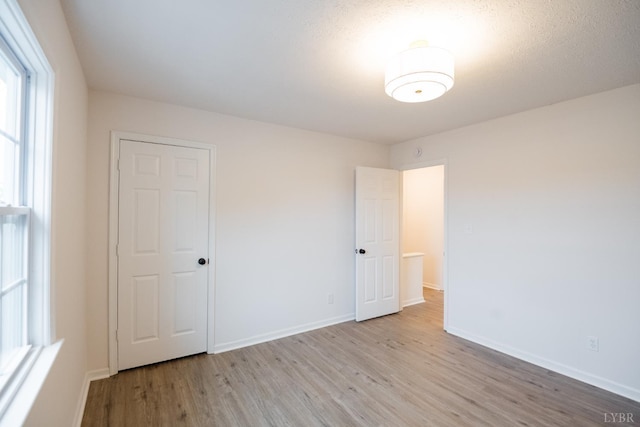 3501 Fort Ave Unit 27, Lynchburg, VA 24501 - unfurnished bedroom featuring light wood-style flooring and baseboards