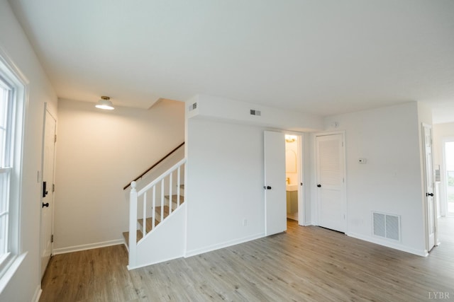 3501 Fort Ave Unit 27, Lynchburg, VA 24501 - empty room with wood finished floors, stairway, and baseboards