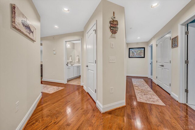 100 Bridgewater Pointe Pl Unit 401, Moneta, VA 24121 - hall with light wood-type flooring, recessed lighting, and baseboards