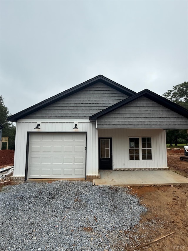 451 Dearborn Rd, Evington, VA 24550 - view of front facade with driveway, an attached garage, and a porch