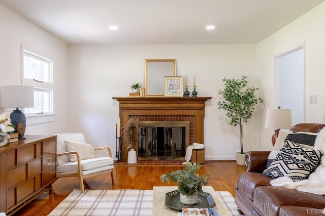 1261 Krise Cir, Lynchburg, VA 24503 - living room featuring wood finished floors, a brick fireplace, and recessed lighting