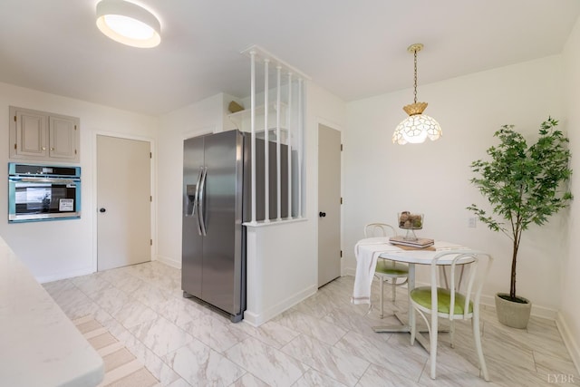 1261 Krise Cir, Lynchburg, VA 24503 - kitchen featuring stainless steel appliances, light marble finish floors, light countertops, baseboards, and hanging light fixtures