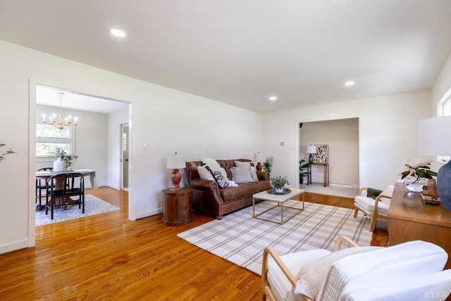 1261 Krise Cir, Lynchburg, VA 24503 - living room with light wood-style flooring, a chandelier, recessed lighting, and baseboards
