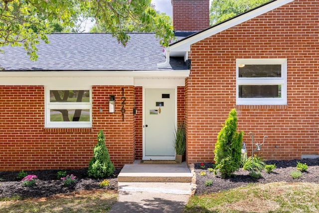 1261 Krise Cir, Lynchburg, VA 24503 - entrance to property with brick siding, a chimney, and roof with shingles