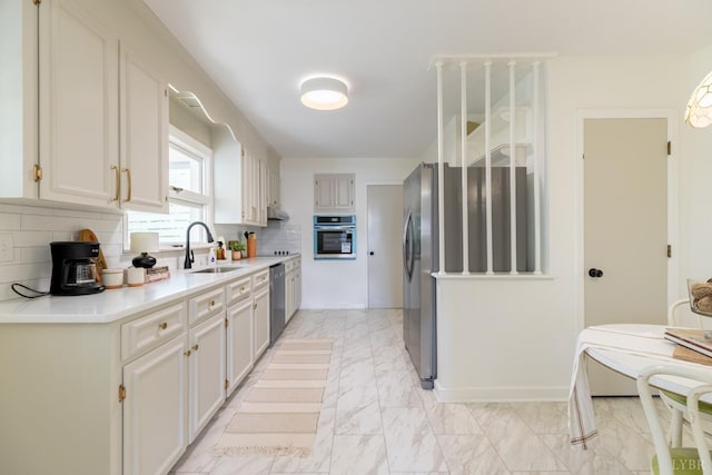 1261 Krise Cir, Lynchburg, VA 24503 - kitchen featuring appliances with stainless steel finishes, a sink, light marble finish flooring, light countertops, and tasteful backsplash