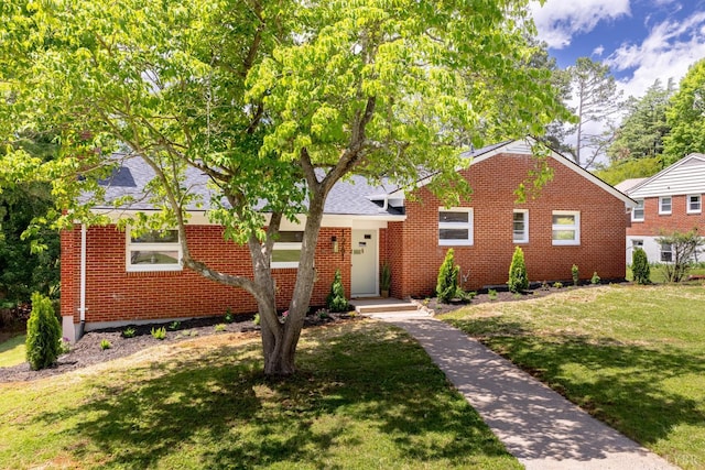 1261 Krise Cir, Lynchburg, VA 24503 - bungalow-style home with brick siding, a front yard, and a shingled roof