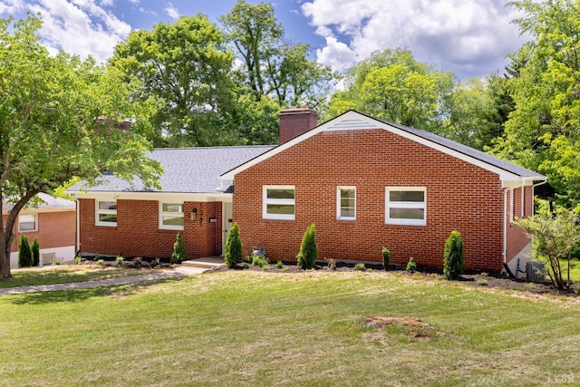1261 Krise Cir, Lynchburg, VA 24503 - view of front of property with a chimney, a front lawn, and brick siding