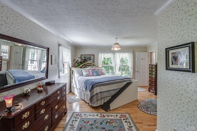 1146 Audubon Dr, Lynchburg, VA 24503 - bedroom with wallpapered walls, crown molding, a textured ceiling, and light wood-style flooring