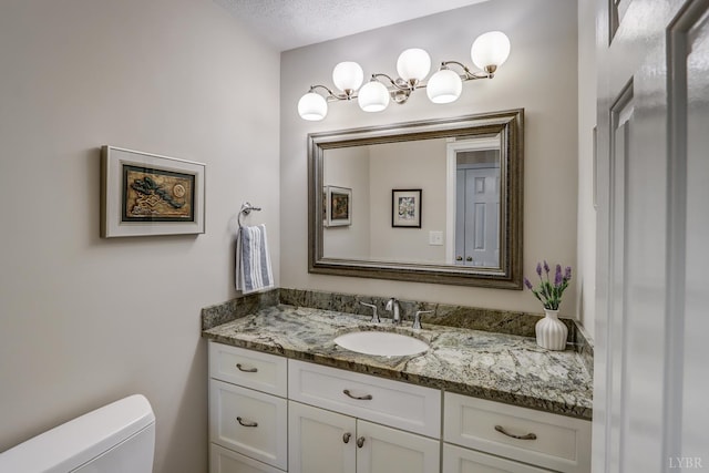 1146 Audubon Dr, Lynchburg, VA 24503 - bathroom featuring vanity, toilet, a textured ceiling, and a chandelier