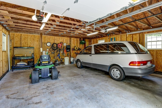 1146 Audubon Dr, Lynchburg, VA 24503 - garage featuring a garage door opener and wooden walls