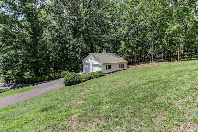1146 Audubon Dr, Lynchburg, VA 24503 - view of property exterior featuring a yard, a chimney, and a view of trees