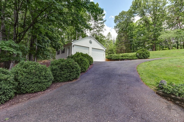 1146 Audubon Dr, Lynchburg, VA 24503 - view of property exterior with a detached garage, a yard, and view of scattered trees