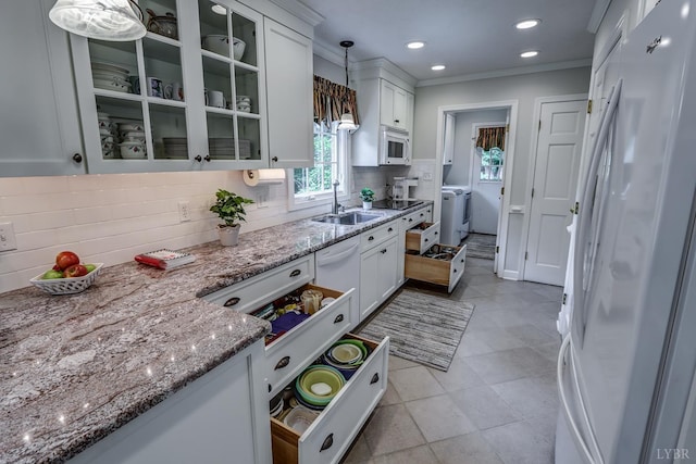 1146 Audubon Dr, Lynchburg, VA 24503 - kitchen with white appliances, a sink, washing machine and clothes dryer, white cabinetry, and ornamental molding
