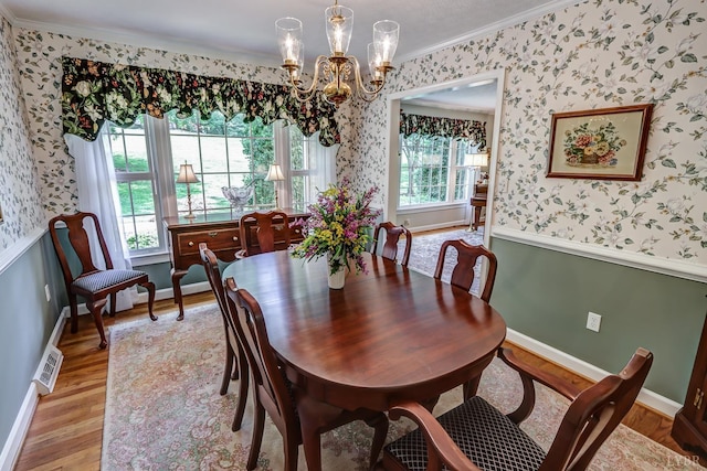 1146 Audubon Dr, Lynchburg, VA 24503 - dining area featuring crown molding, wallpapered walls, baseboards, a chandelier, and light wood-style floors