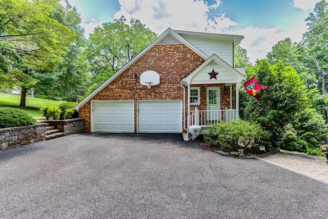 1146 Audubon Dr, Lynchburg, VA 24503 - view of front of property with brick siding, asphalt driveway, and an attached garage