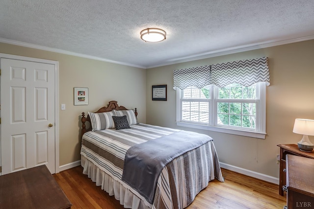 1146 Audubon Dr, Lynchburg, VA 24503 - bedroom featuring wood finished floors, ornamental molding, baseboards, and a textured ceiling
