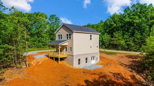 17 Kershaw Dr, Rustburg, VA 24588 - rear view of property with a forest view and driveway
