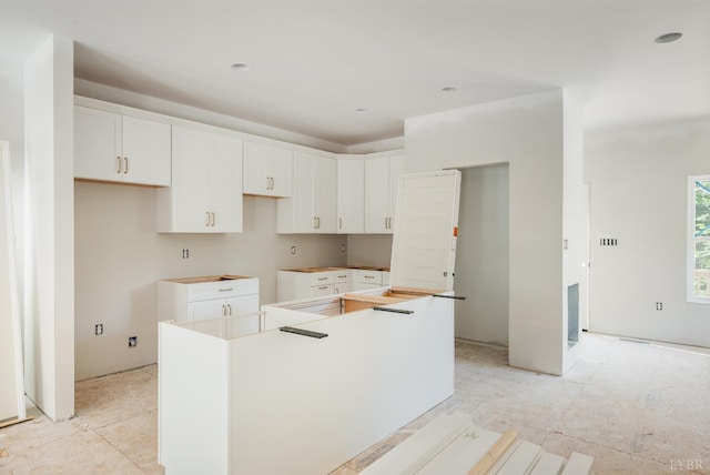 17 Kershaw Dr, Rustburg, VA 24588 - kitchen featuring a kitchen island and white cabinetry