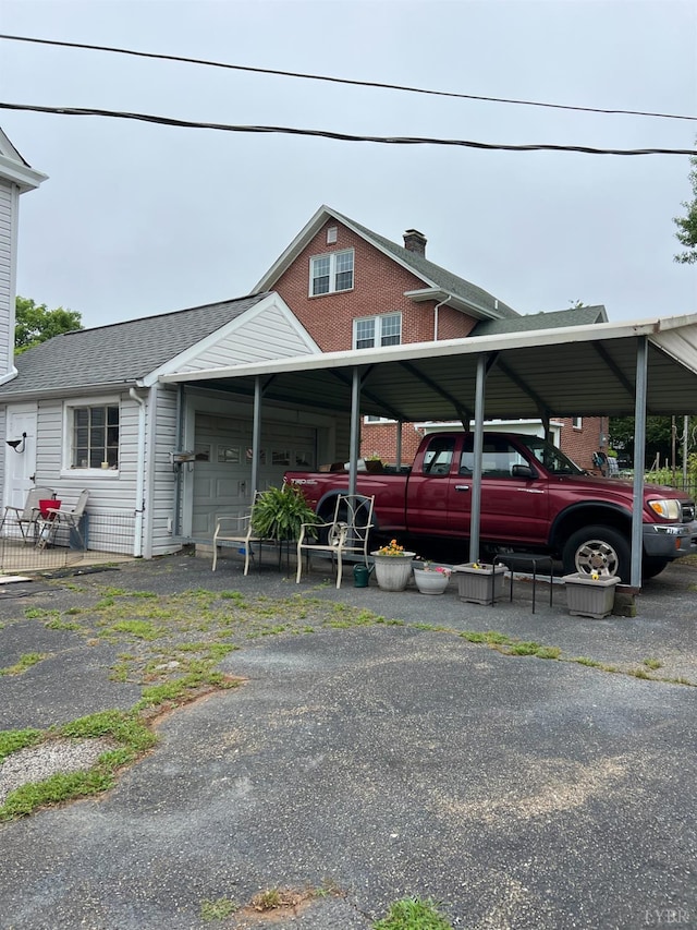 901 Bedford Ave, Altavista, VA 24517 - view of front of home featuring a carport, roof with shingles, and an attached garage