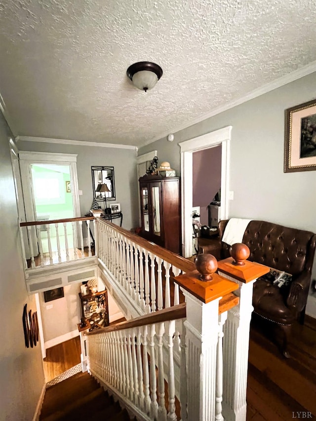 901 Bedford Ave, Altavista, VA 24517 - stairway with wood finished floors, a textured ceiling, ornamental molding, and baseboards