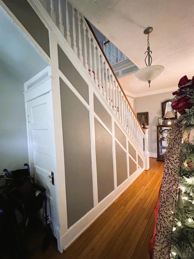 901 Bedford Ave, Altavista, VA 24517 - stairway featuring hardwood / wood-style flooring, ornamental molding, and baseboards