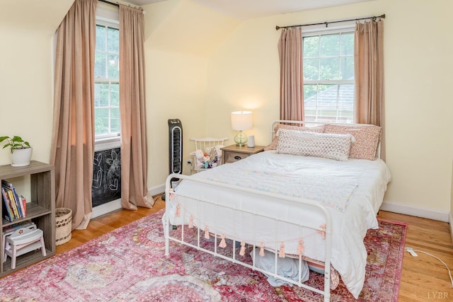213 Kensington Ave, Lynchburg, VA 24503 - bedroom with wood finished floors, lofted ceiling, access to outside, and baseboards